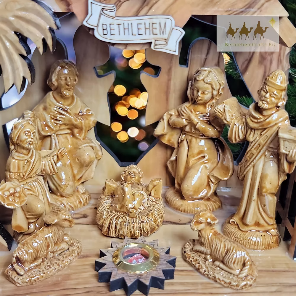Close-up of the figures and detailed carving in an olive-wood nativity set